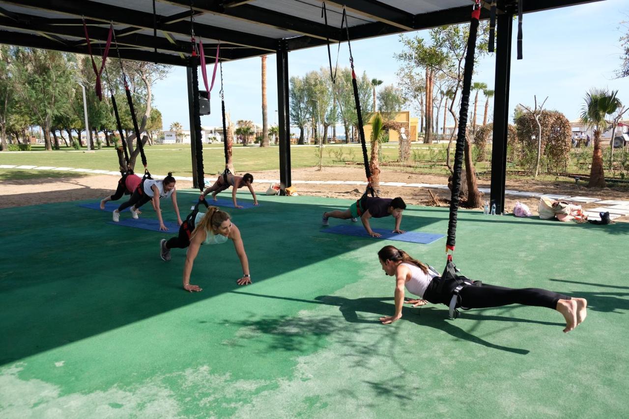 فندق Lara Barut Collection أنطاليا المظهر الخارجي الصورة A group of women doing yoga at the park